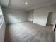 Large main bedroom with carpet and multiple windows at 263 Arwen Drive Lot 65, Mcdonough, GA 30252