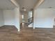 Open living area with hardwood floors and views to the foyer and staircase at 263 Arwen Drive Lot 65, Mcdonough, GA 30252