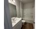 Clean bathroom with bathtub, shower, and white vanity at 263 Arwen Drive Lot 65, Mcdonough, GA 30252