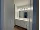 Double vanity bathroom with a large mirror and light fixtures at 263 Arwen Drive Lot 65, Mcdonough, GA 30252