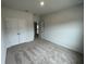 Spacious bedroom with double door closet and access to hallway at 263 Arwen Drive Lot 65, Mcdonough, GA 30252