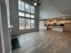 Spacious great room with high ceilings, fireplace, and kitchen views at 263 Arwen Drive Lot 65, Mcdonough, GA 30252