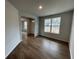 Bright dining room with hardwood floors and a view of the front yard at 263 Arwen Drive Lot 65, Mcdonough, GA 30252