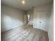 Spacious bedroom with carpet, double doors, and access to bathroom at 263 Arwen Drive Lot 65, Mcdonough, GA 30252