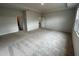 Spacious main bedroom with carpet and access to bathroom at 263 Arwen Drive Lot 65, Mcdonough, GA 30252