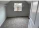 Bright bedroom with window and carpet flooring at 263 Arwen Drive Lot 65, Mcdonough, GA 30252