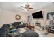 Living room with sectional sofa, fireplace and large TV at 6407 Gothards Ln, Douglasville, GA 30134