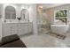 Elegant bathroom with double vanity, walk-in shower, and free-standing tub at 1940 Fellowship Rd, Tucker, GA 30084