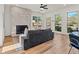Living room with fireplace, hardwood floors, and large windows at 1940 Fellowship Rd, Tucker, GA 30084