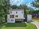 Modern two-story home with a three car garage at 1940 Fellowship Rd, Tucker, GA 30084