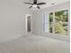 Spacious bedroom with ceiling fan and large window at 1940 Fellowship Rd, Tucker, GA 30084