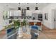 Modern kitchen with white cabinetry, quartz countertops, and a breakfast bar at 1940 Fellowship Rd, Tucker, GA 30084
