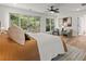 Serene bedroom with hardwood floors, sliding doors to deck and sitting area at 1940 Fellowship Rd, Tucker, GA 30084