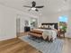 Spacious primary bedroom with hardwood floors and access to a private balcony at 1940 Fellowship Rd, Tucker, GA 30084