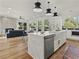 Modern kitchen with white cabinets, a large island, and stainless steel appliances at 1940 Fellowship Rd, Tucker, GA 30084