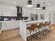 Modern kitchen with white cabinets, quartz countertops, and stainless steel appliances at 1940 Fellowship Rd, Tucker, GA 30084
