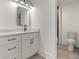 Modern bathroom with white vanity, black matte faucet, and tiled floors at 1940 Fellowship Rd, Tucker, GA 30084