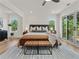 Spacious main bedroom with hardwood floors and sliding glass doors to a deck at 1940 Fellowship Rd, Tucker, GA 30084