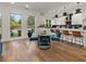 Modern dining area with glass table and blue velvet chairs at 1940 Fellowship Rd, Tucker, GA 30084