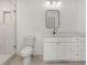 Modern bathroom with white vanity, marble countertop and walk-in shower at 1940 Fellowship Rd, Tucker, GA 30084