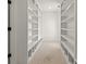 Large walk-in closet with built-in shelves, perfect for storage at 1940 Fellowship Rd, Tucker, GA 30084