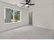 Bright bedroom with ceiling fan and large window offering natural light at 1940 Fellowship Rd, Tucker, GA 30084