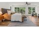 Relaxing bedroom with hardwood floors and sliding doors leading to a deck at 1940 Fellowship Rd, Tucker, GA 30084