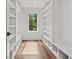 Custom-built walk-in closet with ample shelving and hanging space at 1940 Fellowship Rd, Tucker, GA 30084