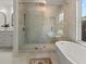 Spa-like bathroom with large walk-in shower and freestanding soaking tub at 1940 Fellowship Rd, Tucker, GA 30084