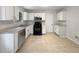 Well-equipped kitchen with white cabinets and tile flooring at 2110 Glenwood Downs Dr, Decatur, GA 30035