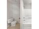 Simple bathroom with a toilet, sink and shower at 2110 Glenwood Downs Dr, Decatur, GA 30035
