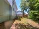 Side view of the house showcasing a deck and backyard at 2110 Glenwood Downs Dr, Decatur, GA 30035