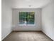 Bright bedroom with a large window offering views of nature at 2110 Glenwood Downs Dr, Decatur, GA 30035