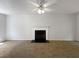 Spacious living room featuring a fireplace and neutral carpeting at 2110 Glenwood Downs Dr, Decatur, GA 30035