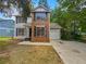 Brick two-story home with attached garage at 2110 Glenwood Downs Dr, Decatur, GA 30035