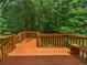 Wooden deck overlooking a lush wooded backyard at 2110 Glenwood Downs Dr, Decatur, GA 30035