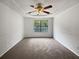 Spacious bedroom with large window and ceiling fan at 2110 Glenwood Downs Dr, Decatur, GA 30035
