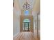 Two-story entry with hardwood floors, chandelier, and stained-glass door at 4567 Brigade Ne Ct, Roswell, GA 30075