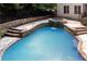 Inviting in-ground pool with hot tub and stonework at 4567 Brigade Ne Ct, Roswell, GA 30075