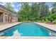 Inviting pool with stone patio and lush greenery at 540 Carriage Ne Dr, Atlanta, GA 30328