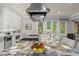 Gourmet kitchen boasts a stunning agate countertop and high-end appliances at 540 Carriage Ne Dr, Atlanta, GA 30328