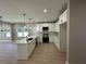 Modern kitchen with white cabinets and quartz countertops at 459 Lee Sw Rd, Mableton, GA 30126