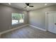 Well-lit bedroom featuring a large window and ceiling fan at 459 Lee Sw Rd, Mableton, GA 30126