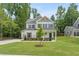 Two story home with front porch and landscaping at 4405 Ryker Rd, Cumming, GA 30041