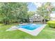Inviting in-ground pool with large backyard and patio at 303 Walnutwood Trl, Roswell, GA 30075
