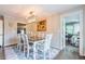 Bright dining room with hardwood floors and a view into the kitchen at 303 Walnutwood Trl, Roswell, GA 30075
