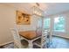 Elegant dining room with hardwood floors, large windows, and a chandelier at 303 Walnutwood Trl, Roswell, GA 30075