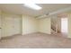 Unfinished basement with neutral carpet and ample space at 303 Walnutwood Trl, Roswell, GA 30075