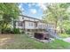 Home's backyard features a hot tub and deck at 303 Walnutwood Trl, Roswell, GA 30075