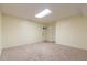 Unfinished basement with neutral carpet and ample space at 303 Walnutwood Trl, Roswell, GA 30075